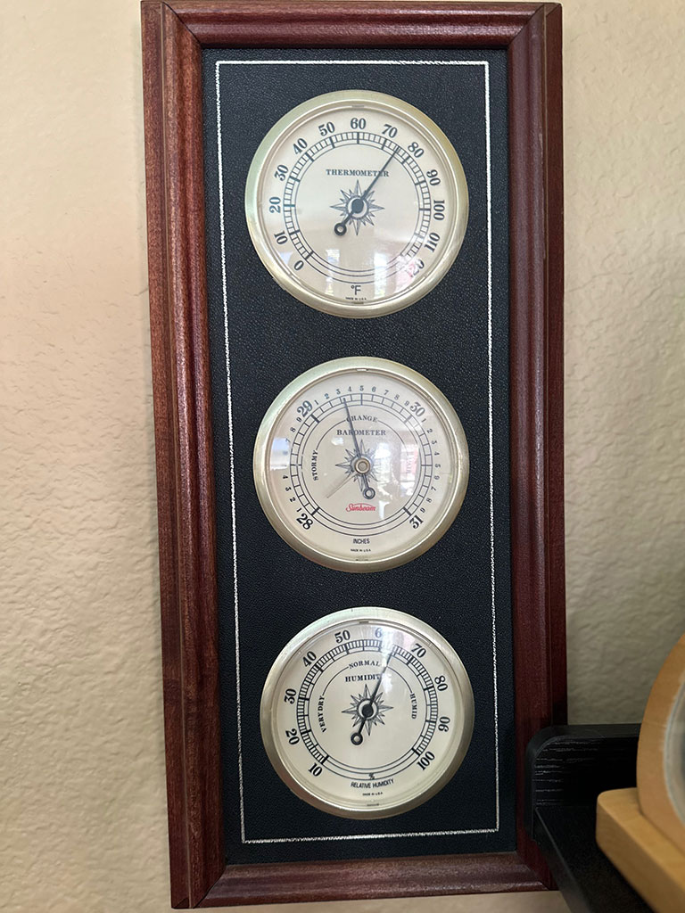 Analog Temperature, Barometer, and Hygrometer mounted on the wall to keep track of indoor comfort.